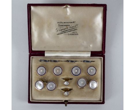 A gentleman's mother-of-pearl, enamel and pearl dress set, comprising: four buttons, a pair of cufflinks and two shirt studs,