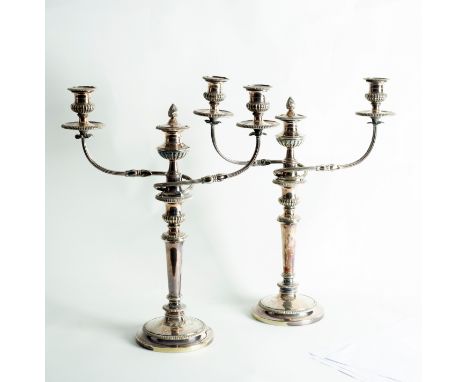 A pair of silver plated three-light, two-branch candelabra, each on column support and circular foot, 49cm high