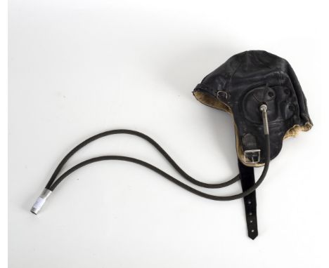 A leather flying helmet, labels inside for TC Marsh & Sons Ltd., Bristol, named in ink RD Young, size 6 1/8 