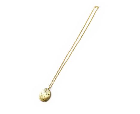 A Locket on Chain, the engraved oval locket on a 9 carat gold curb link chain, pendant length 3.2cm, chain length 41.5cmLocke