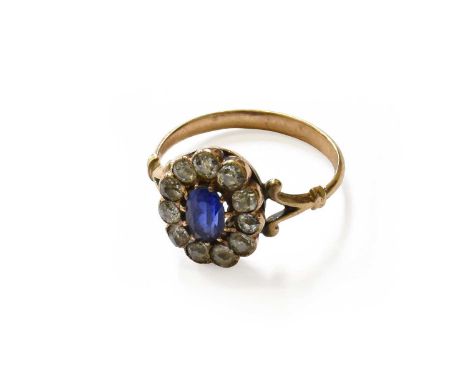 A Sapphire and Diamond Cluster Ring, unmarked, finger size KGross weight 2.8 grams.
