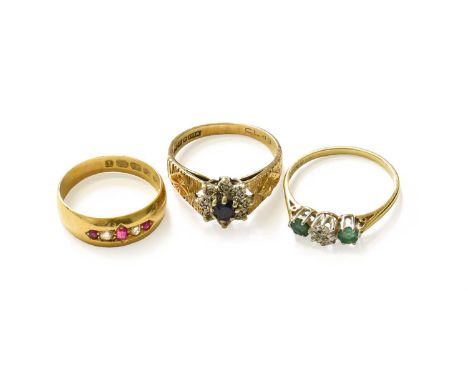 An 18 Carat Gold Ruby and Diamond Five Stone Ring, finger size L; A 9 Carat Gold Emerald and Diamond Three Stone Ring, finger