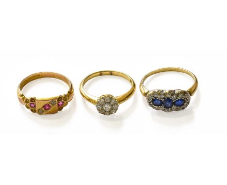 A 15 Carat Gold Ruby and Diamond Ring, finger size L1/2; A Sapphire and Diamond Cluster Ring, unmarked, finger size L1/2; and
