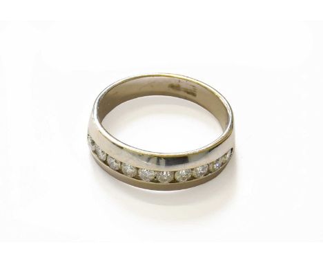 A Diamond Half Hoop Ring, the ten round brilliant cut diamonds in white channel settings, to a plain polished shank, finger s