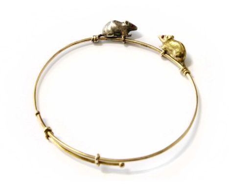An Expanding Mouse Bangle, the mice with synthetic ruby eyes, inner measurements 6.2cm by 5.3cmUnmarked. Gross weight 11.6 gr