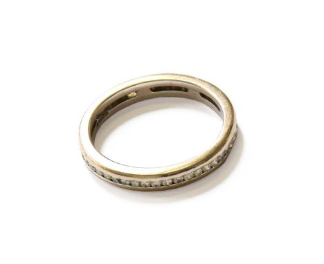 An 18 Carat White Gold Diamond Eternity Ring, finger size M1/2NB: One diamond deficient.The ring is in poor condition, one di