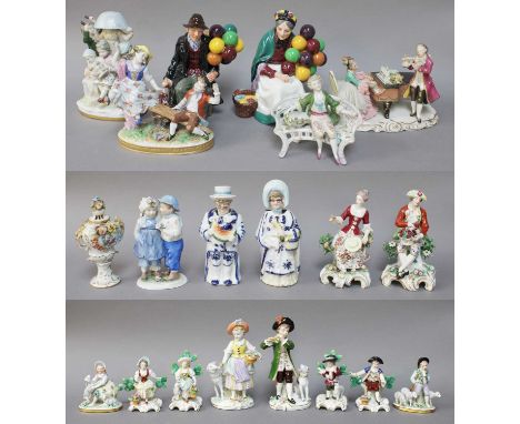 A Pair of Sitzendorf Figures, one of a boy playing a flute, the other a shepherdess, together with Another Smaller Pair of Sh