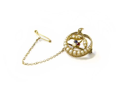 An Early 20th Century Split Pearl, Ruby and Diamond Brooch, measures 2.1cmBears no hallmark nor stamp. Gross weight 4.3 grams
