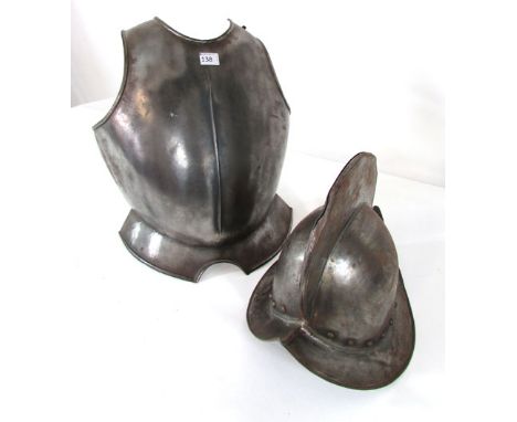 A reproduction 16th century pattern comb morion style steel helmet together with a steel breastplate 