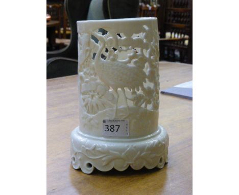 A Royal Worcester reticulated 'Tusk' vase, circa 1880, decorated with exotic birds amongst pine tree, incised 10/70, applied 