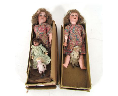 A pair of German bisque headed dolls, possibly Armand Marseille, model 390, both with brown sleep eyes, open mouth showing fo