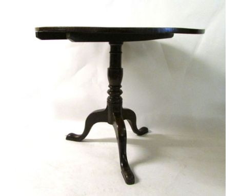 A George III oak circular tilt top occasional table on turned column and tripod base, d. 83 cm CONDITION REPORT: Surface has 