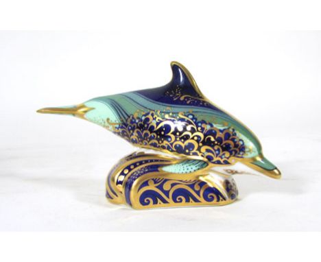 Baby bottle nose dolphin,a Royal Crown paperweight, gold button, boxed CONDITION REPORT: Good