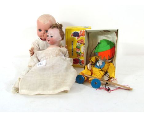 A PM Grete bisque head doll, blue glass sleep eyes, open mouth showing 2 teeth, h. 26 cm; together with Rosebud plastic heade