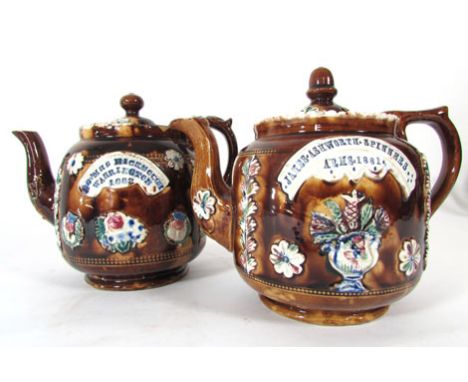 Two Bargeware tea pots, one inscribed 'James Ashworth, Spinners Arms, 1881', the other 'Mr and Mrs Hickmough, Warrington, 188