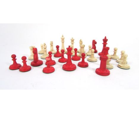 A bone chess set, early 20th century, natural and red stained, h. of king 4.2 cm  CONDITION REPORT: Lacking 3 pieces, some ru