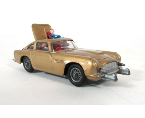 A Corgi James Bond Aston Martin DB5, in gold, with passenger CONDITION REPORT: Generally good, possible re-painting