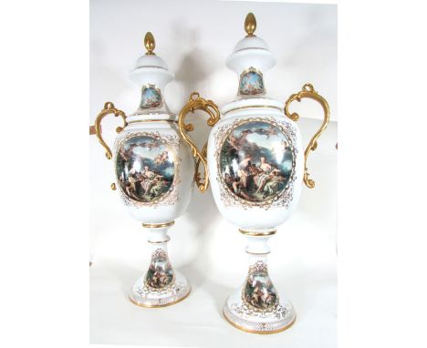 A large pair of Sevres style vases and covers, of two handled baluster form with printed old master style scenes on a white g