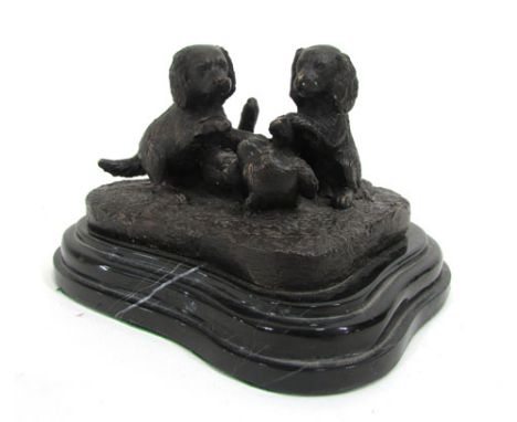 After Fratin, three puppies playing, a patinated bronzed group on a black marble base, 16 cm CONDITION REPORT: Good, rubbing 