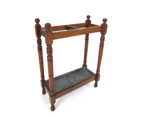 A late Victorian mahogany framed, two section stick stand with metal drip tray. h. 69 cm, w. 51 cm. CONDITION REPORT: Seen pl