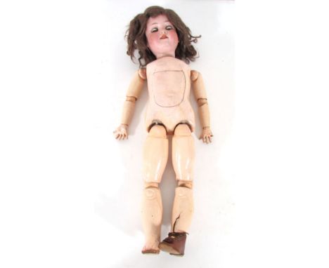 An Armand Marseille bisque headed doll model 390/A5M, with voice box, blue glass sleep eyes, open mouth with four teeth showi