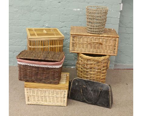 A bamboo laundry hamper and mixture of basketware.