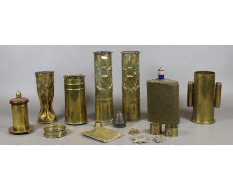 Eleven pieces of trench art, a World War Two enamel flask and three cap badges, Royal Armoured corps, RAF and black watch