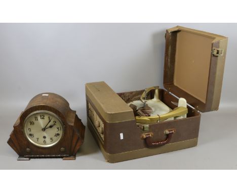 A 1930's oak Westminster chime eight day mantle clock along with a mid C20th record player.