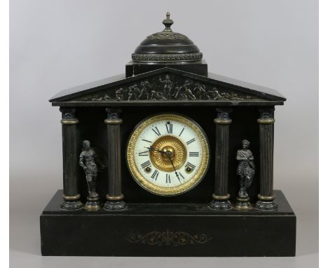 A Victorian slate mantel clock the enamel and gilt dial enclosing twin train movement, flanked by Corinthian columns and sold