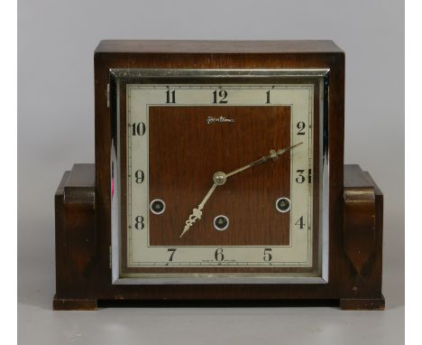 An Art Deco Bentima mantel clock. The Arabic numeral dial with three winding holes and Westminster chime movement with select