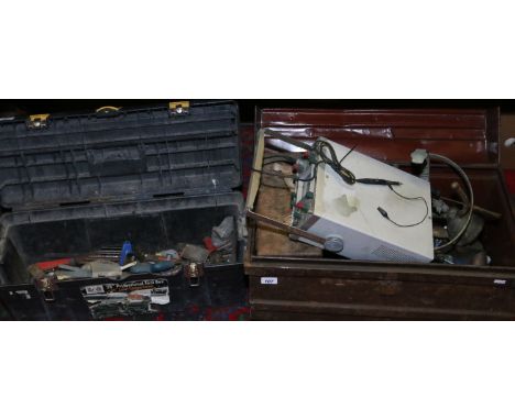 A tin trunk and a tool box containing various tools, ammunition box, sun dial and a Hung Chang oscilloscope.