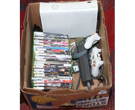 A Microsoft Xbox 360 games console and over 20 games.