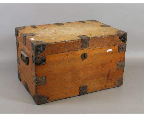 A small C19th metal bound trunk with metal handles corners etc.