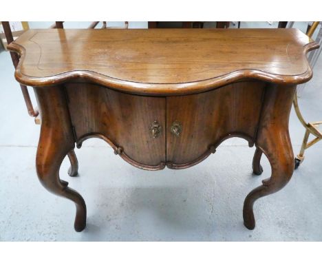 SIDE COMMODE, 102cm x 48cm x 68cm H, of serpentine form with a cupboard. 