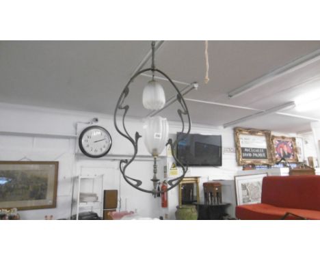 AN ART NOUVEAU BRASS LIGHT FITTING WITH TULIP GLASS LAMP SHADES