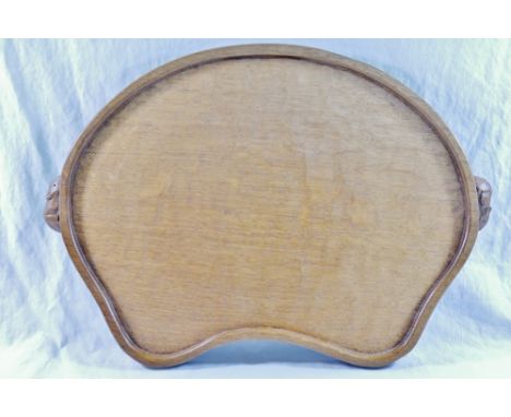 Workshop of Robert Thompson of Kilburn a Mouseman oak kidney shaped tray, the rim carved with two trademark mice handles, 47c