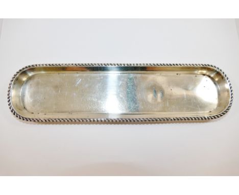 An early 20th century silver pen tray, Birmingham 1912, with gadrooned rim, 24.8cm x 6.5cm, 3.68ozt, 114.5g  CONDITION REPORT