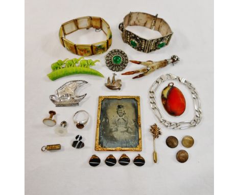 A collection of mainly costume jewellery including a Scottish silver mounted bird claw cloak brooch, a set of banded agate st