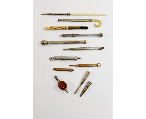 A Victorian silver mounted bone handled pencil, 14.8cm long, two silver propelling pencils, a bone handled nib pen, the handl