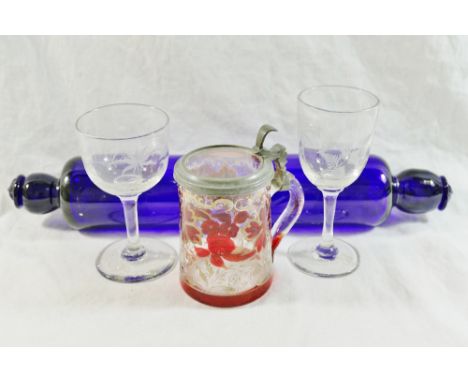 A 19th century Bristol blue glass rolling pin, 35cm long, two 19th century cordial glasses wheel engraved with ferns, and a s