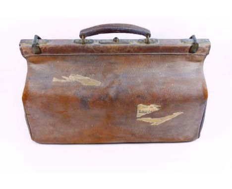 Three items of vintage leather luggage comprised of a Gladstone bag, 46cm x 23cm and a pair of leather travelling bags, 45cm 