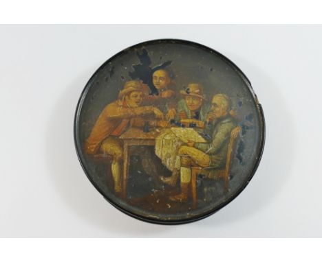 A late 18th century German papier mache circular snuff box, the lid decorated with a scene after Sir David Wilkie of gentleme