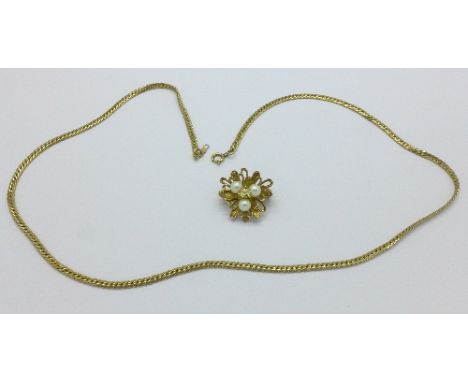 A silver gilt and pearl brooch and a plated chain