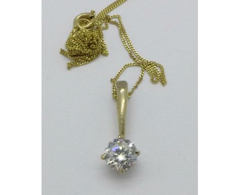 A yellow metal pendant on a 9ct gold chain, 1.1g