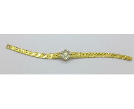 A lady's 18ct gold Jaeger-LeCoultre wristwatch with diamond set bezel, total weight 27.2g