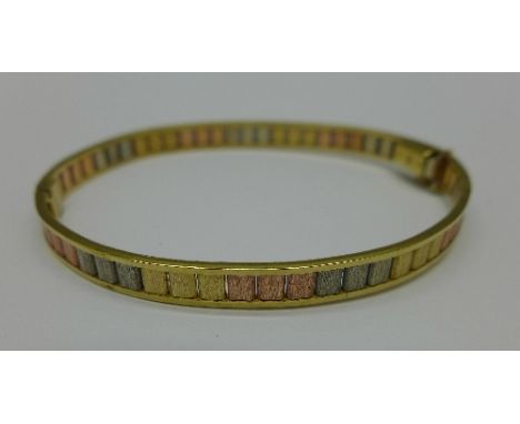 A 9ct gold, multi-coloured gold bangle, 10.6g