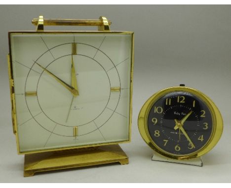 A Swiza 8-day alarm clock and a Westclox Baby Ben alarm clock
