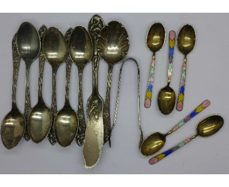 Five silver and enamel spoons and six Art Nouveau spoons, sugar bowls, fish knife and caddy spoon