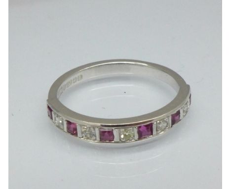 An 18ct white gold, ruby and diamond half eternity ring, 2.7g, M