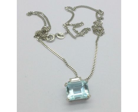 An 18ct white gold, diamond and topaz pendant on an 18ct white gold chain, 5.8g